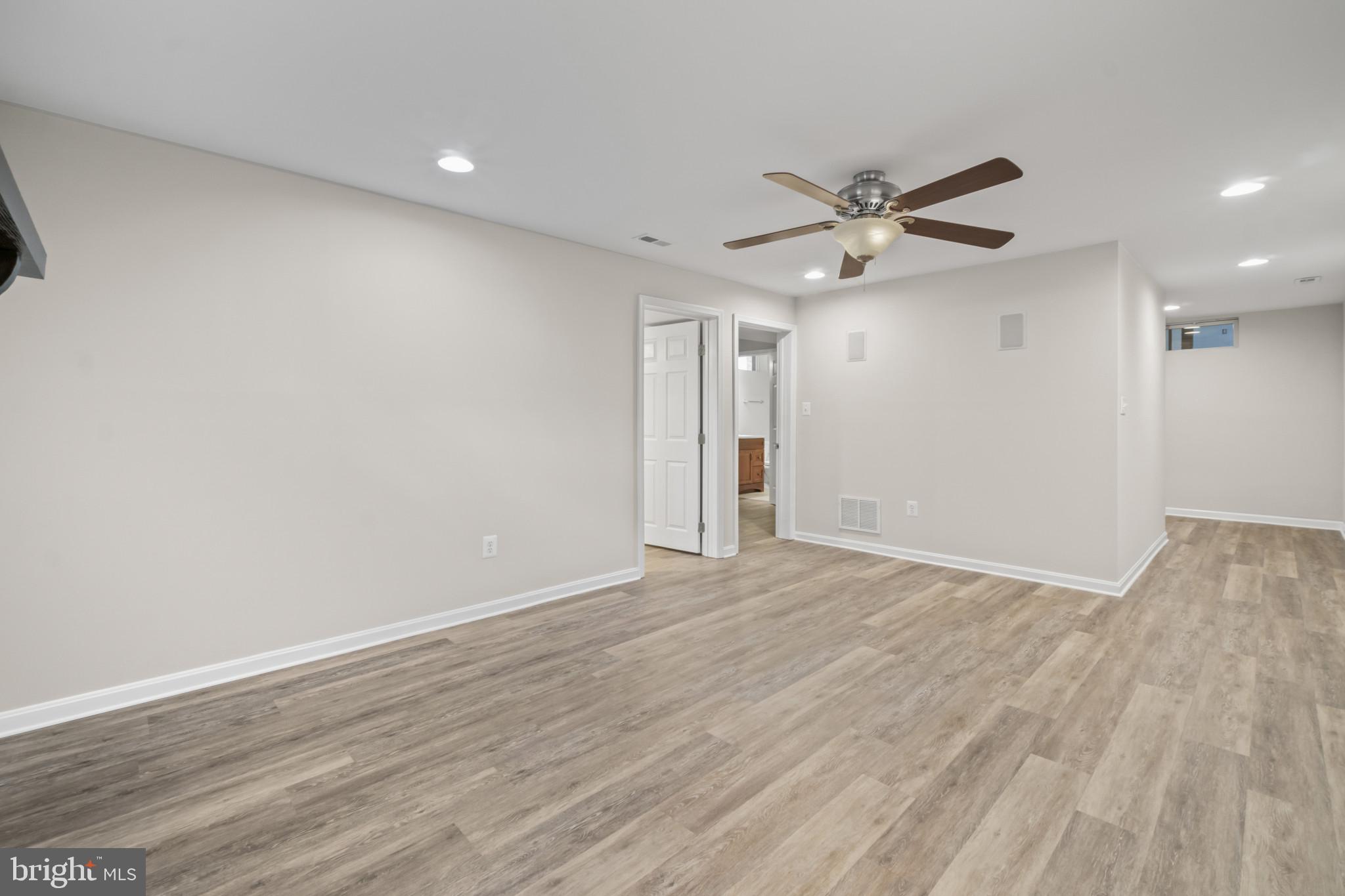 1609 Turkey Point Road Essex, MD 21221 - Photo 30 of 41 wooden floor in an empty room with a window