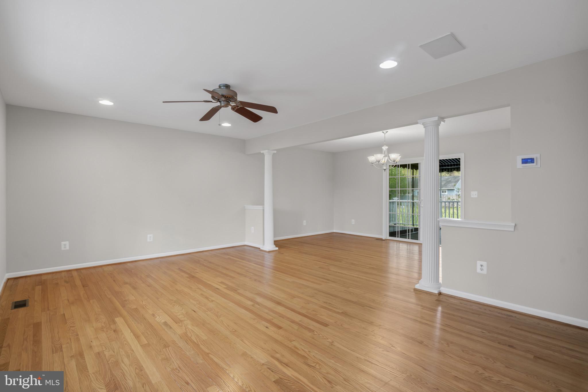 1609 Turkey Point Road Essex, MD 21221 - Photo 7 of 41 a view of empty room with wooden floor and ceiling fan