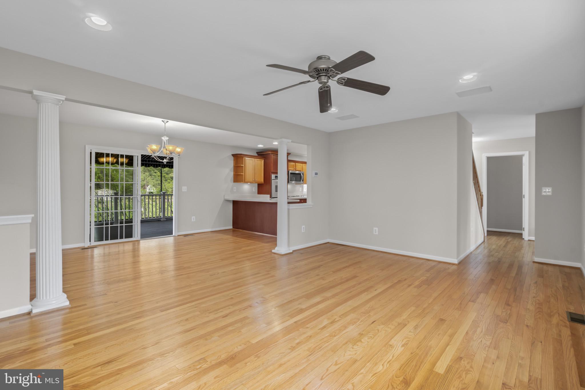 1609 Turkey Point Road Essex, MD 21221 - Photo 8 of 41 a view of empty room with wooden floor and fan