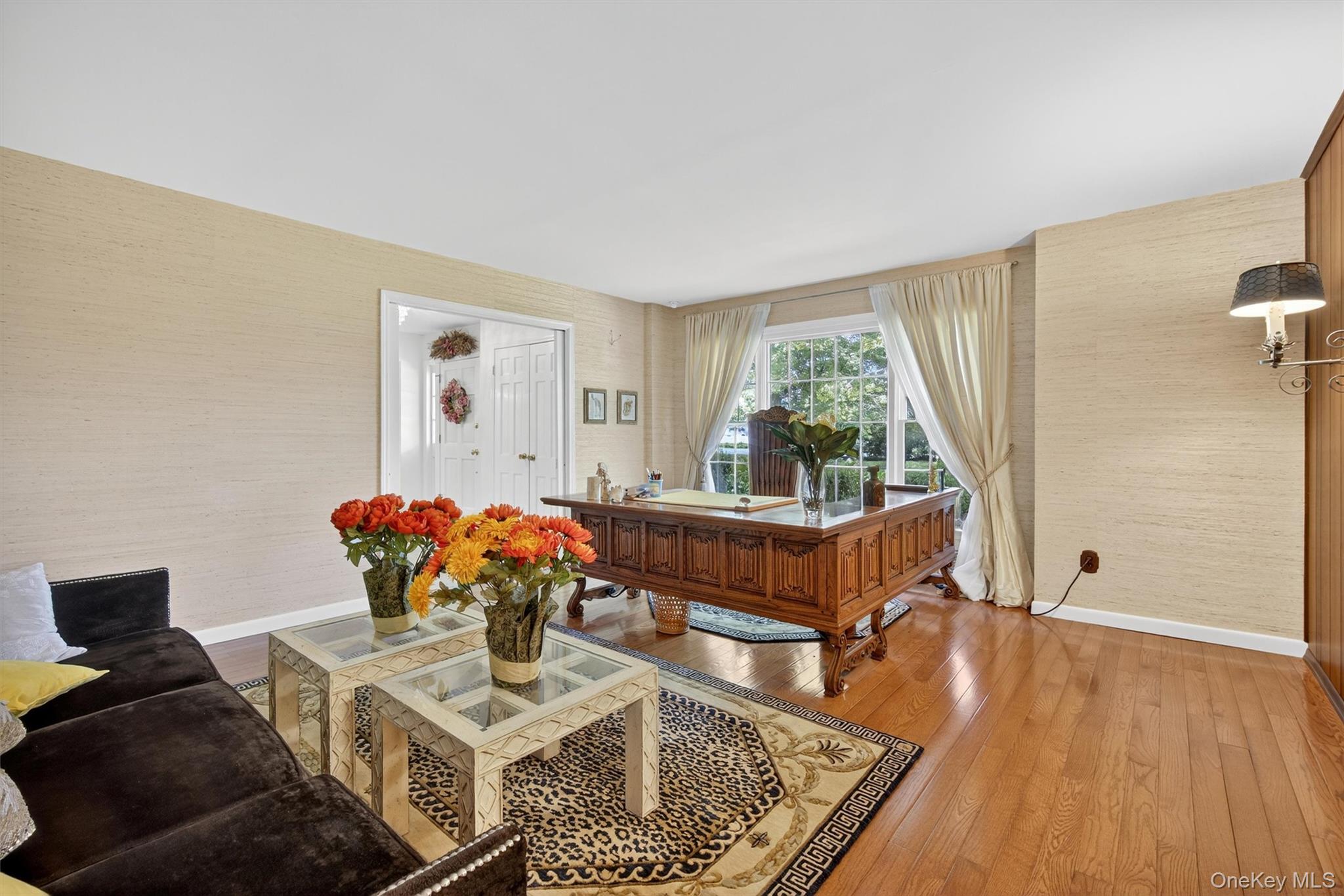 27 Orchard Hill Road Katonah, NY 10536 - Photo 14 of 38 a living room with furniture and a large window