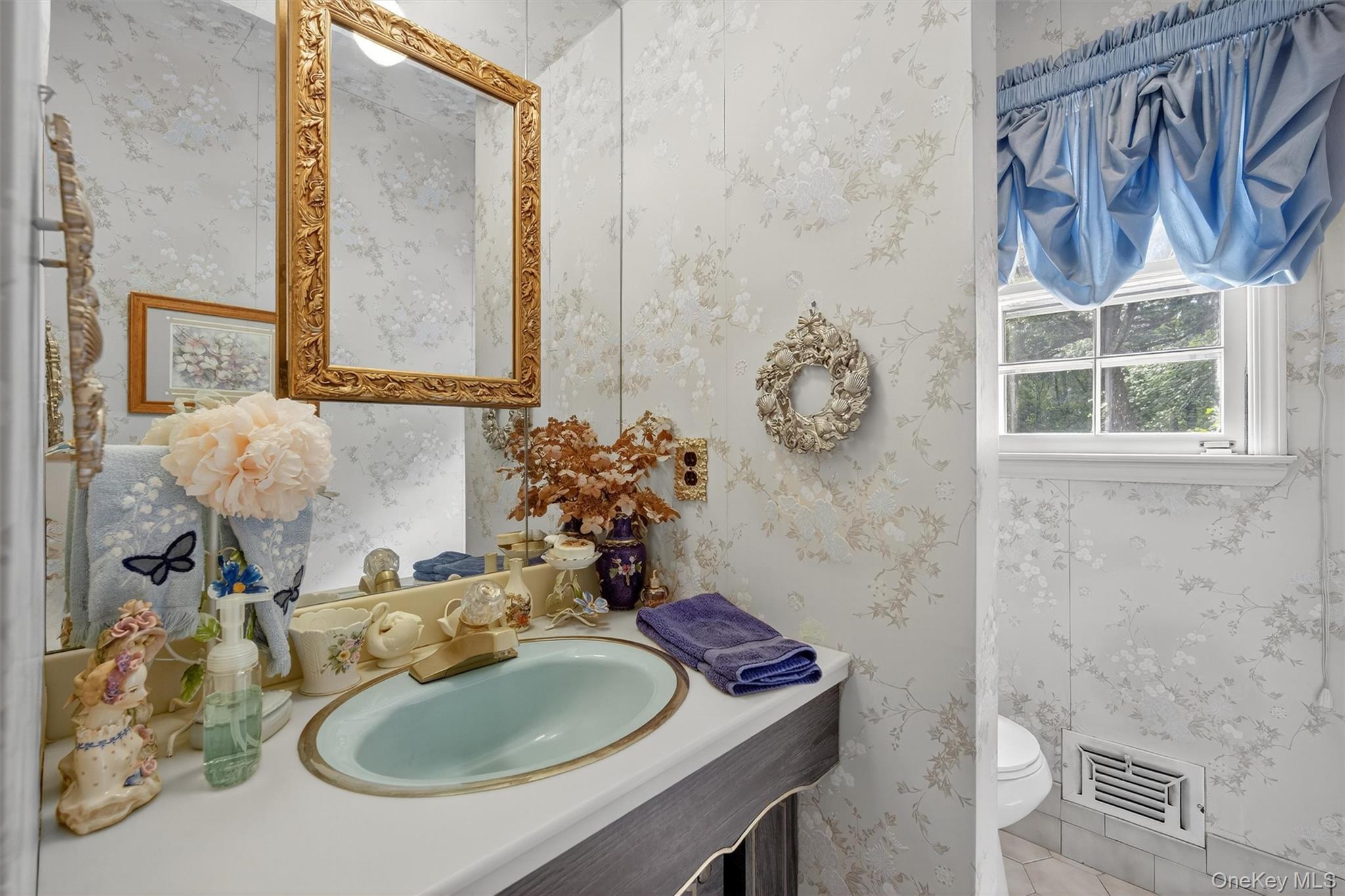 27 Orchard Hill Road Katonah, NY 10536 - Photo 15 of 38 a bathroom with a sink and a mirror