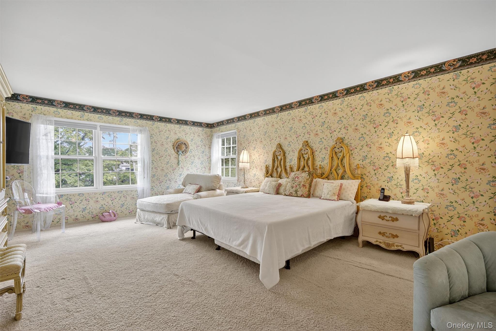 27 Orchard Hill Road Katonah, NY 10536 - Photo 19 of 38 a spacious bedroom with a bed and window