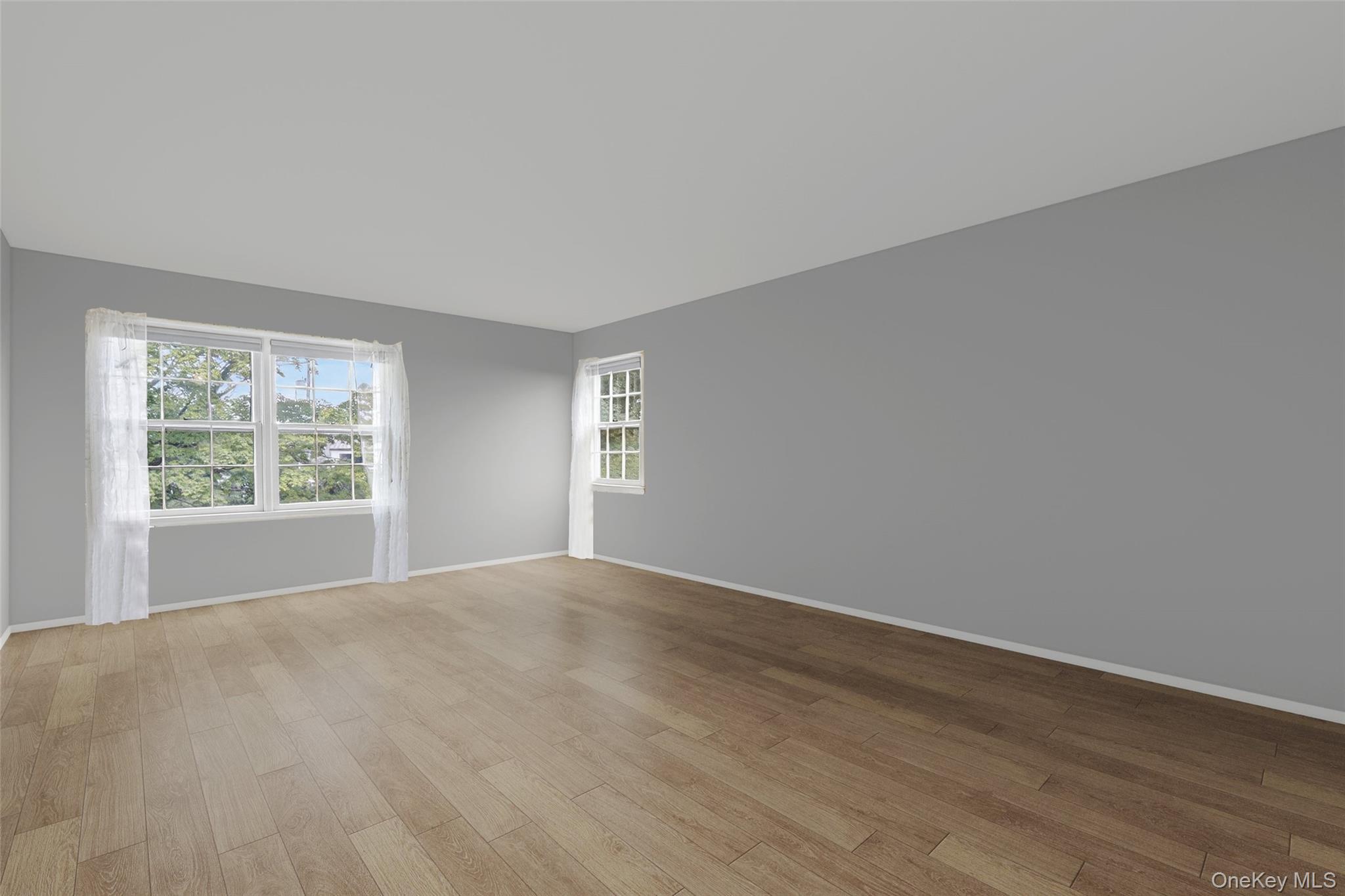 27 Orchard Hill Road Katonah, NY 10536 - Photo 20 of 38 a view of an empty room with wooden floor and a window