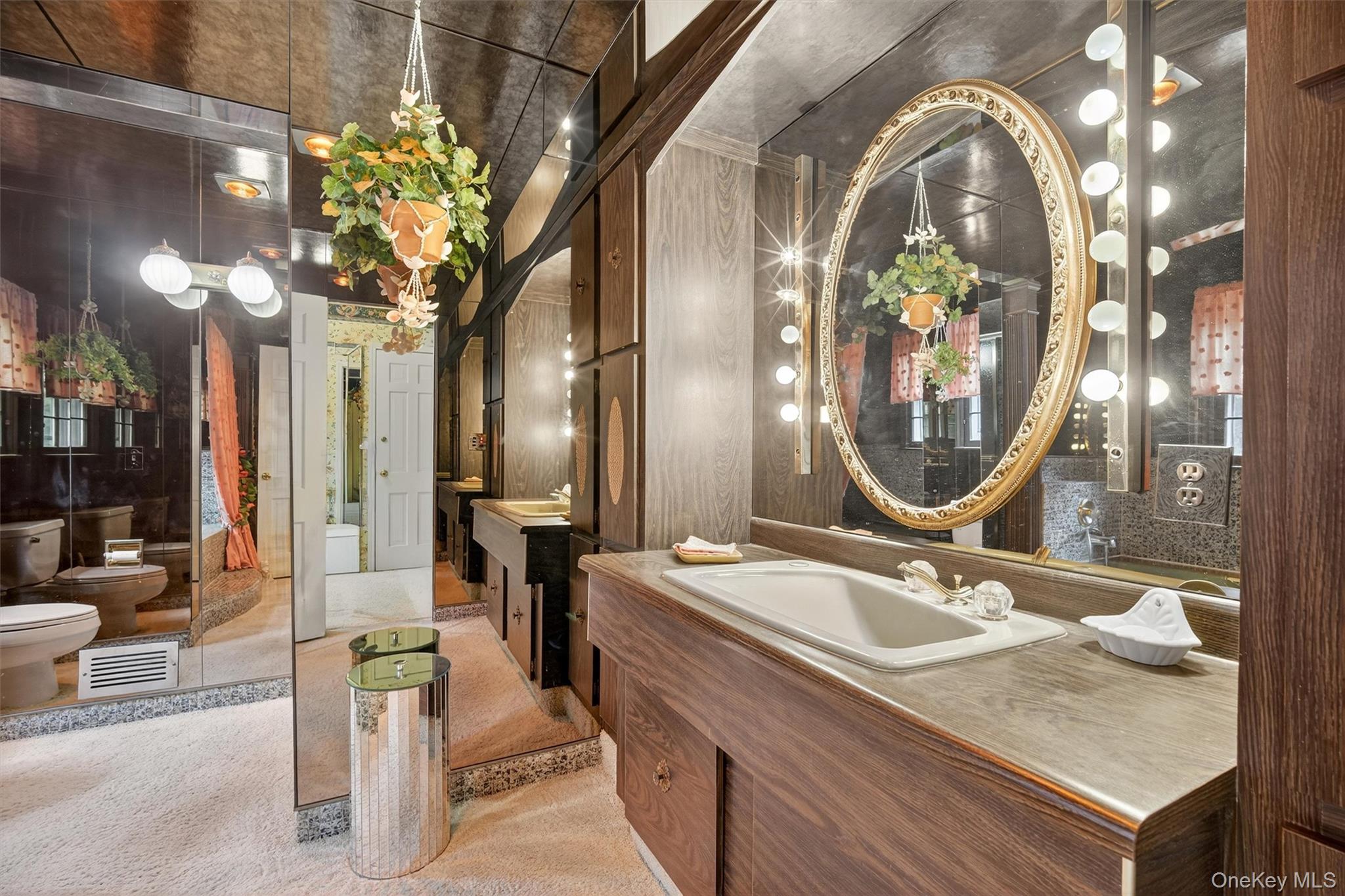 27 Orchard Hill Road Katonah, NY 10536 - Photo 23 of 38 a bathroom with a sink double vanity and a mirror