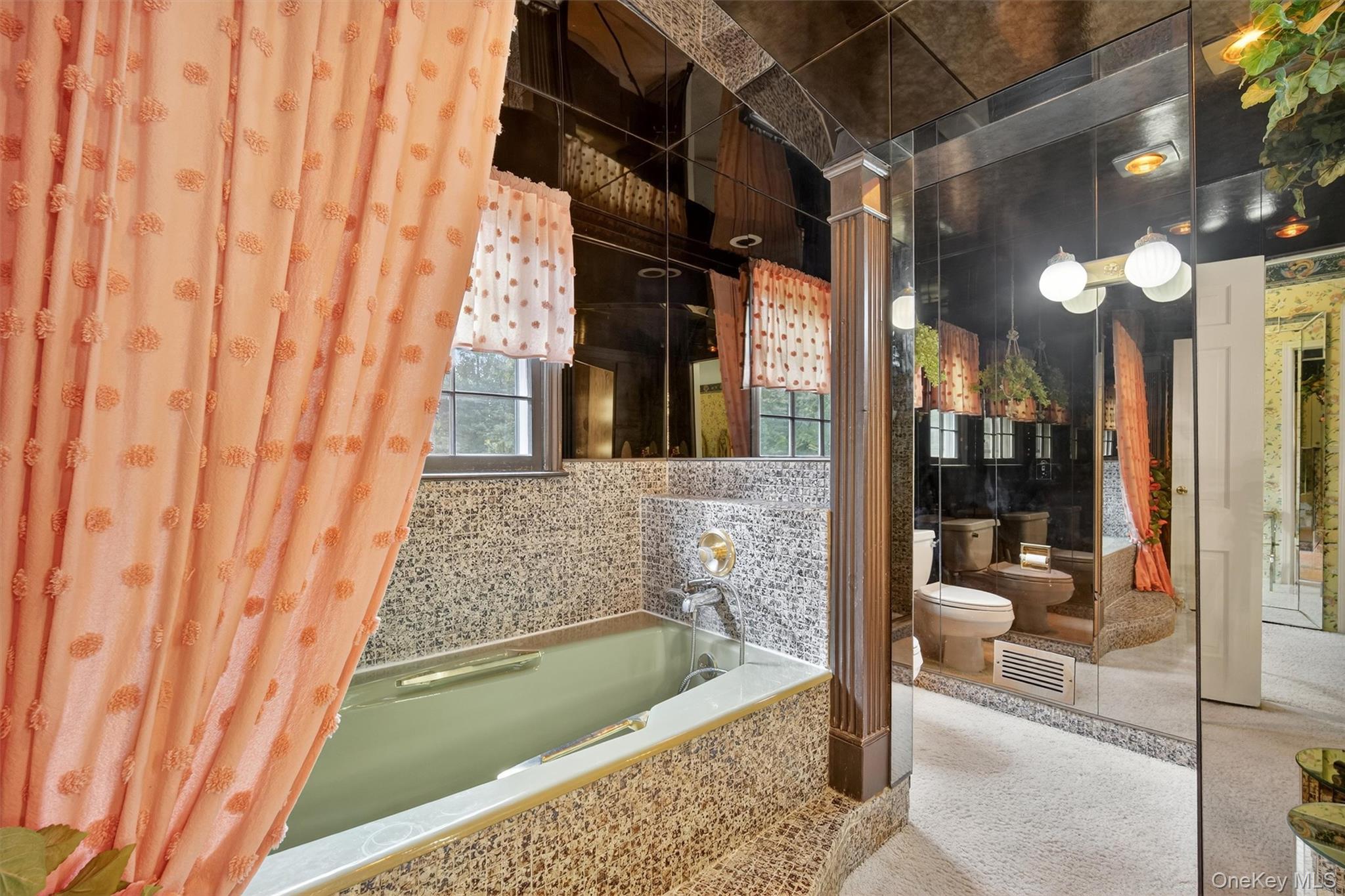 27 Orchard Hill Road Katonah, NY 10536 - Photo 24 of 38 a bathroom with a tub and shower