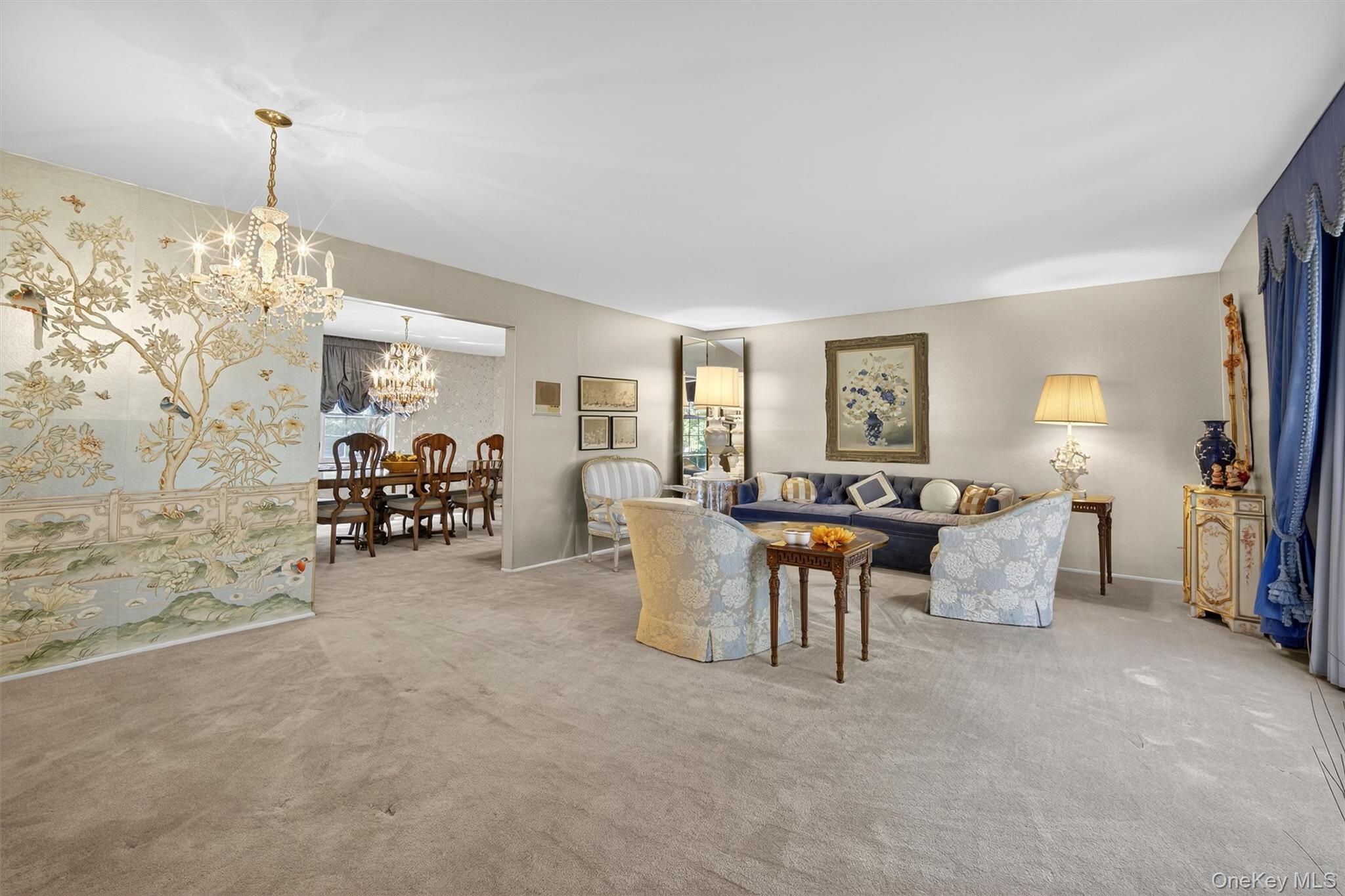 27 Orchard Hill Road Katonah, NY 10536 - Photo 5 of 38 a living room with furniture and a chandelier