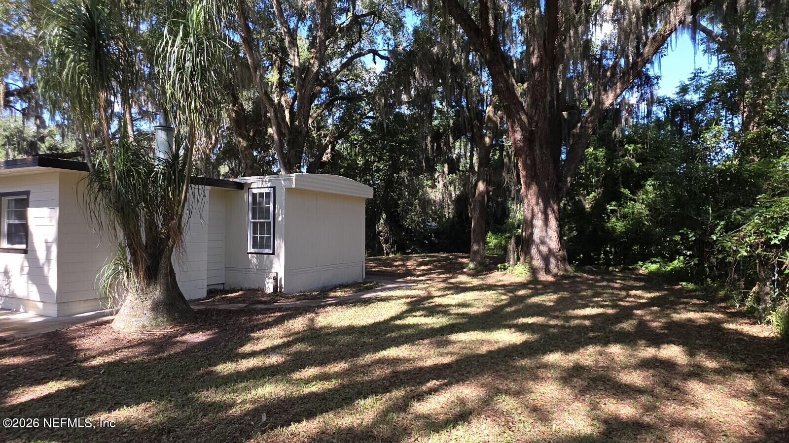 2781 Schaller Road St. Augustine, FL 32084 - Photo 2 of 9 a view of a outdoor space with trees