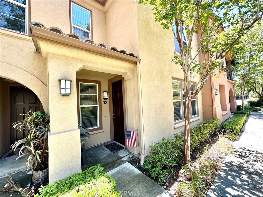 12 Martino Ladera Ranch, CA 92694 - Photo 1 of 17 a front view of a house with a garden