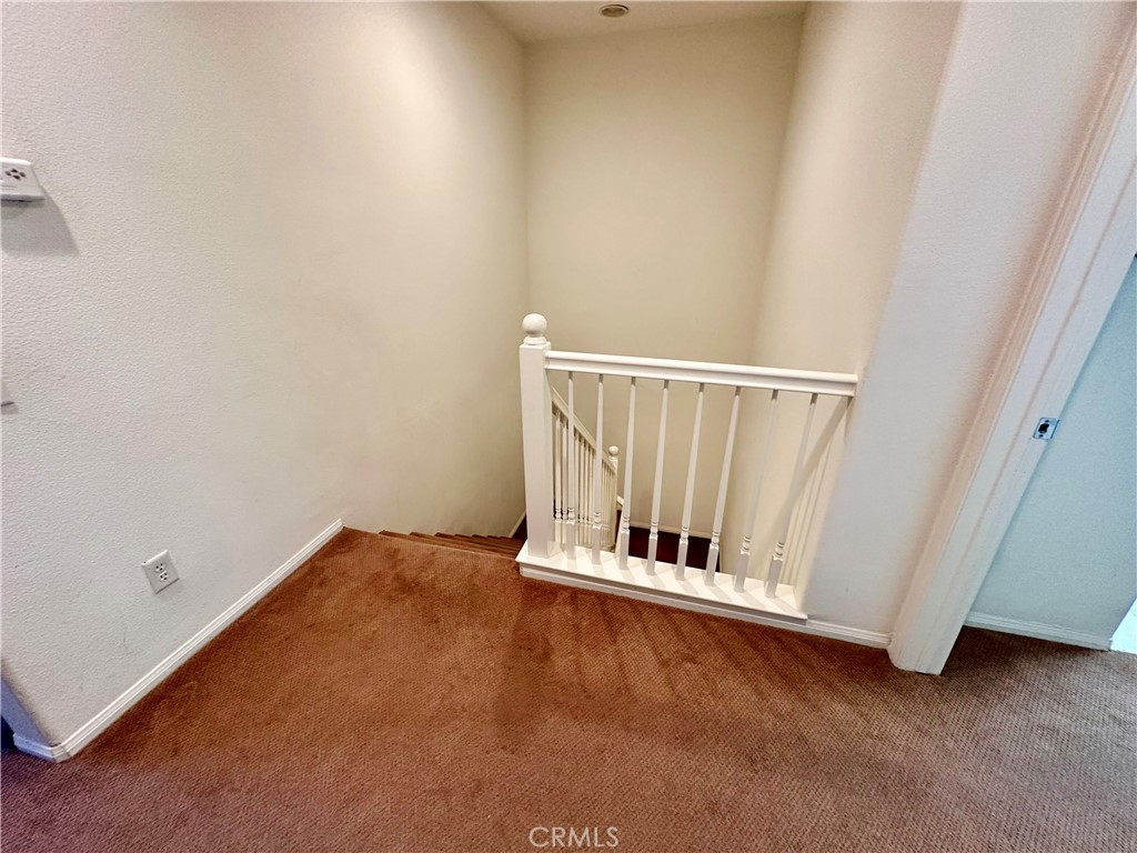 12 Martino Ladera Ranch, CA 92694 - Photo 15 of 17 a view of an empty room with wooden floor