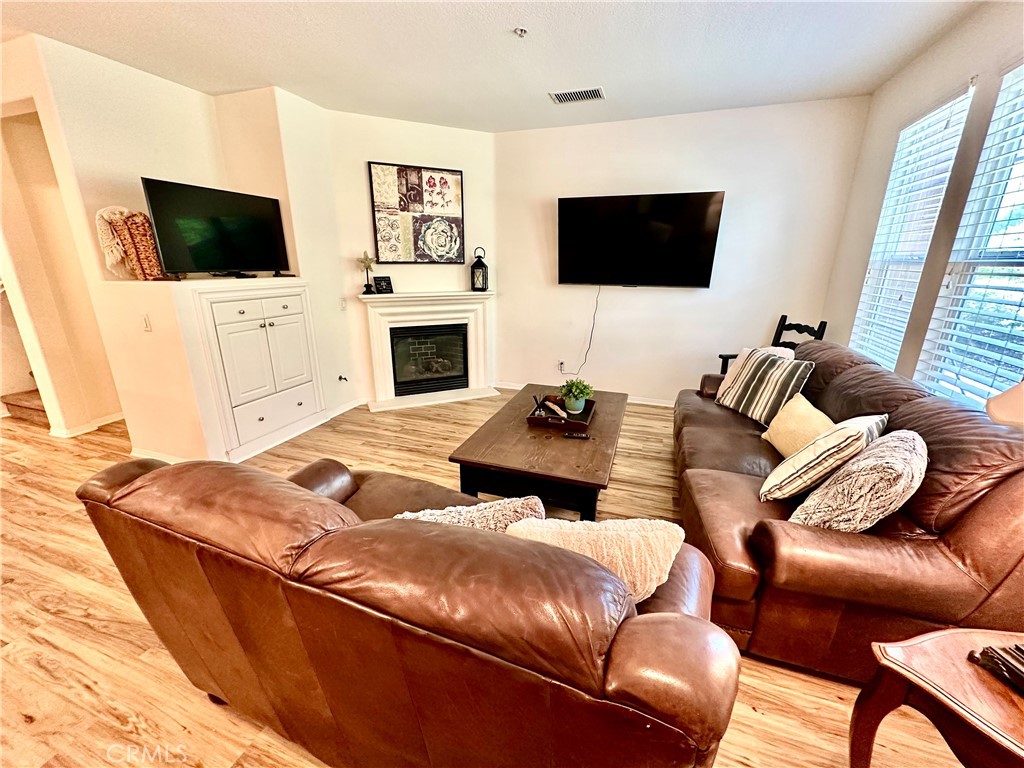 12 Martino Ladera Ranch, CA 92694 - Photo 3 of 17 a living room with furniture and a flat screen tv