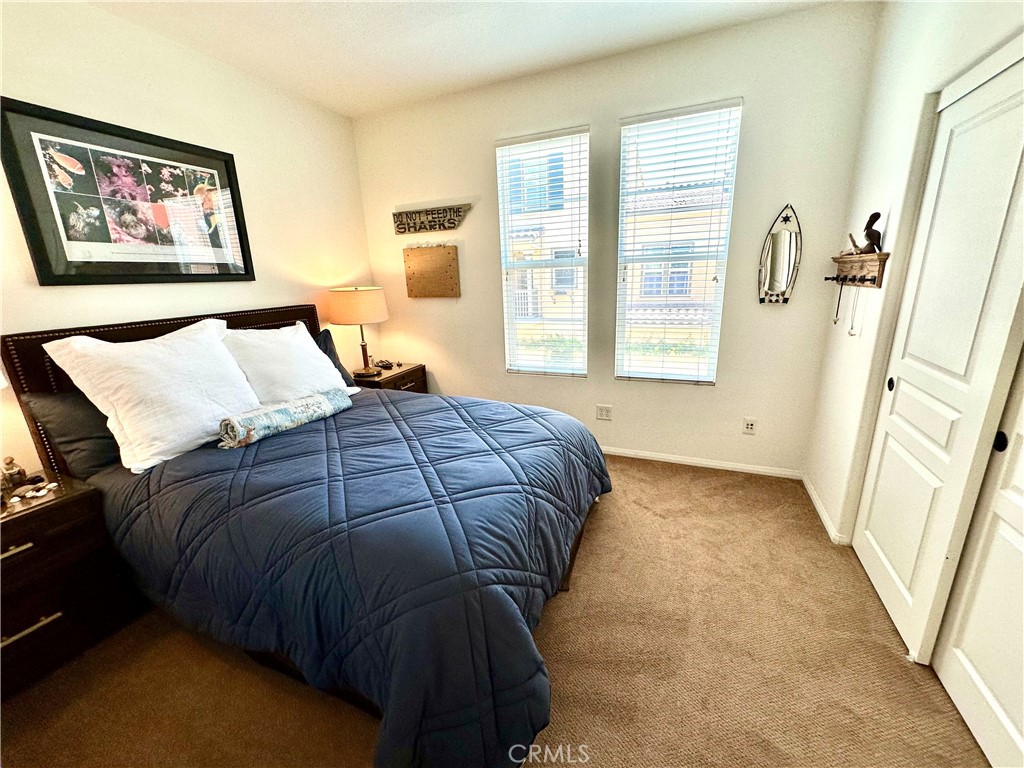 12 Martino Ladera Ranch, CA 92694 - Photo 7 of 17 a bedroom with a bed and a painting on the wall