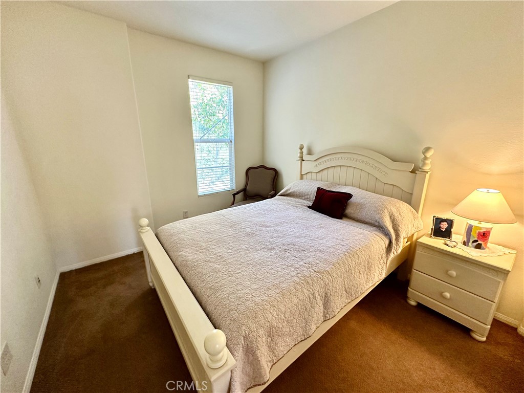 12 Martino Ladera Ranch, CA 92694 - Photo 9 of 17 a bedroom with a bed and a night stand