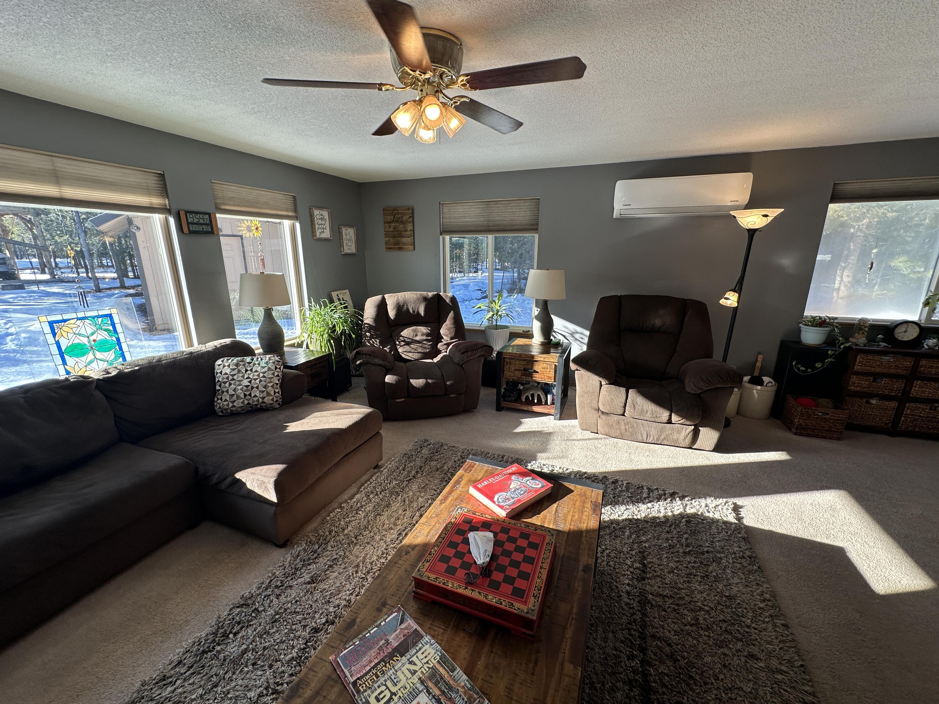 123977 Surveyor Road Crescent Lake, OR 97733 - Photo 12 of 41 a living room with furniture and a flat screen tv