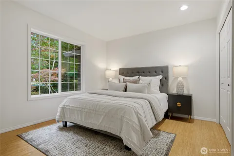 a bedroom with a bed and window