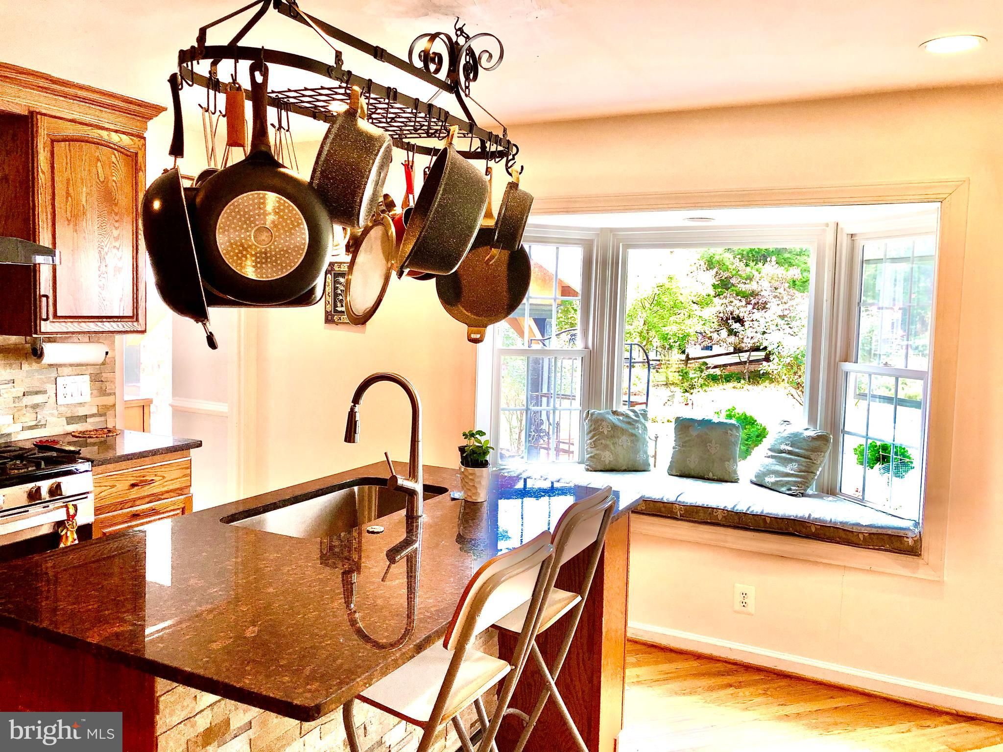 9604 Hall Road Potomac, MD 20854 - Photo 3 of 20 Sun-filled kitchen with window seat view of garden