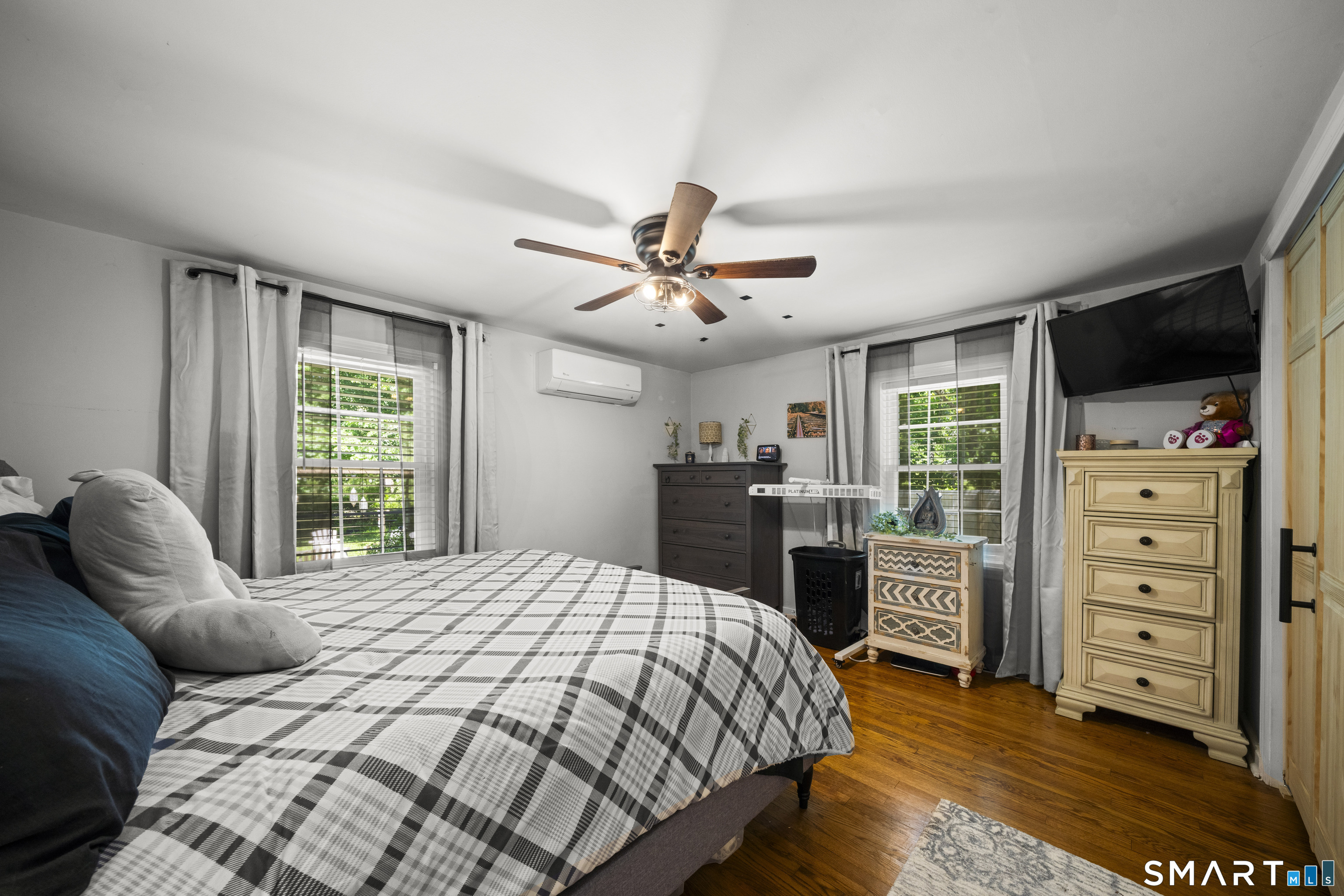 211 Whisconier Road Brookfield, CT 06804 - Photo 16 of 38 a bedroom with a bed a dresser and a window