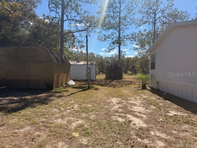16636 Southwest 45th Street Ocala, FL 34481 - Photo 16 of 21 a view of a backyard of a house