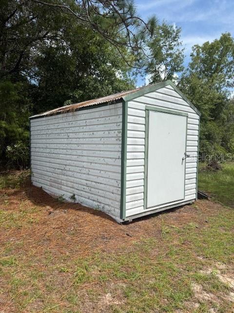 16636 Southwest 45th Street Ocala, FL 34481 - Photo 17 of 21 a view of a house with a yard