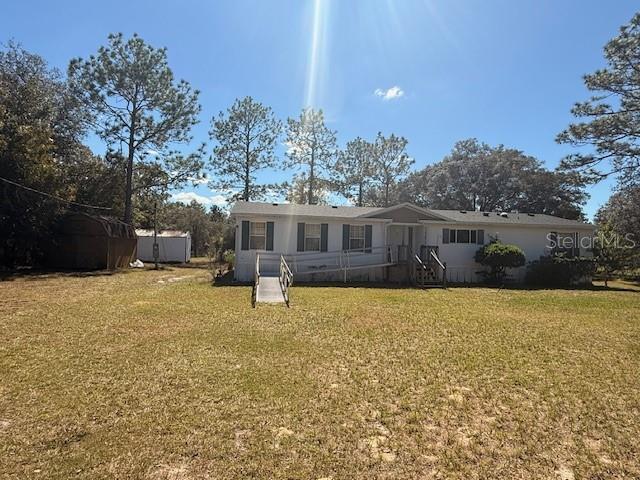 16636 Southwest 45th Street Ocala, FL 34481 - Photo 2 of 21 a house view with a garden space