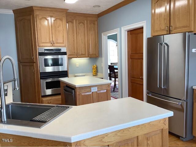 2125 Keith Hills Road Lillington, NC 27546 - Photo 21 of 66 a kitchen with stainless steel appliances a refrigerator and stove