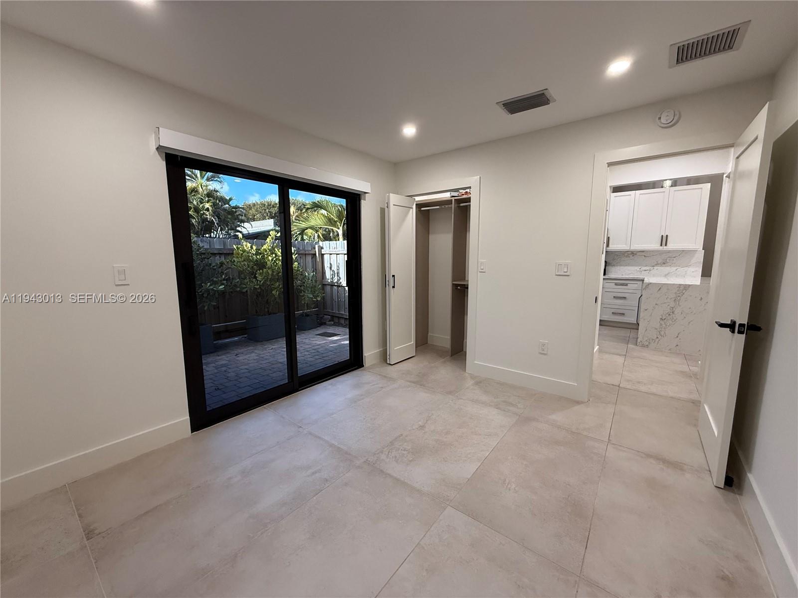 9208 Southwest 132nd Street Miami, FL 33176 - Photo 14 of 24 a view of empty room with a fireplace