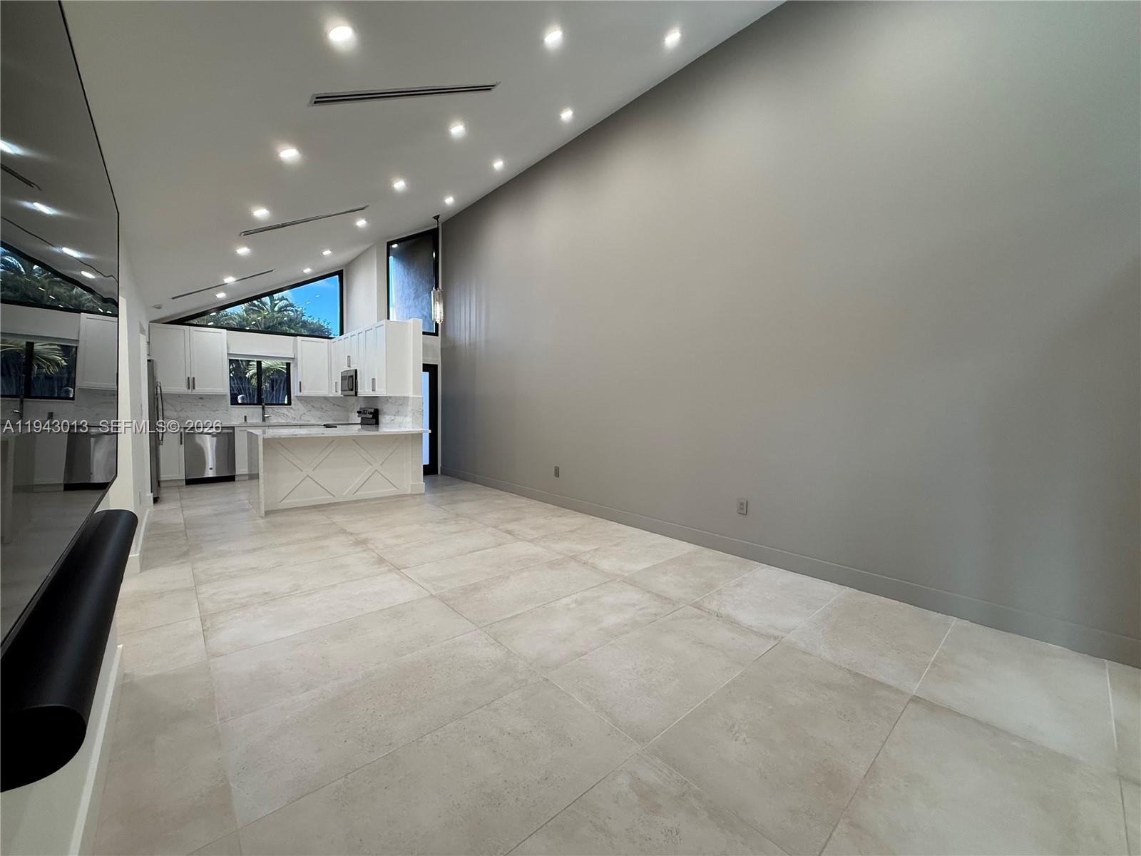 9208 Southwest 132nd Street Miami, FL 33176 - Photo 4 of 24 a view of a living room and kitchen