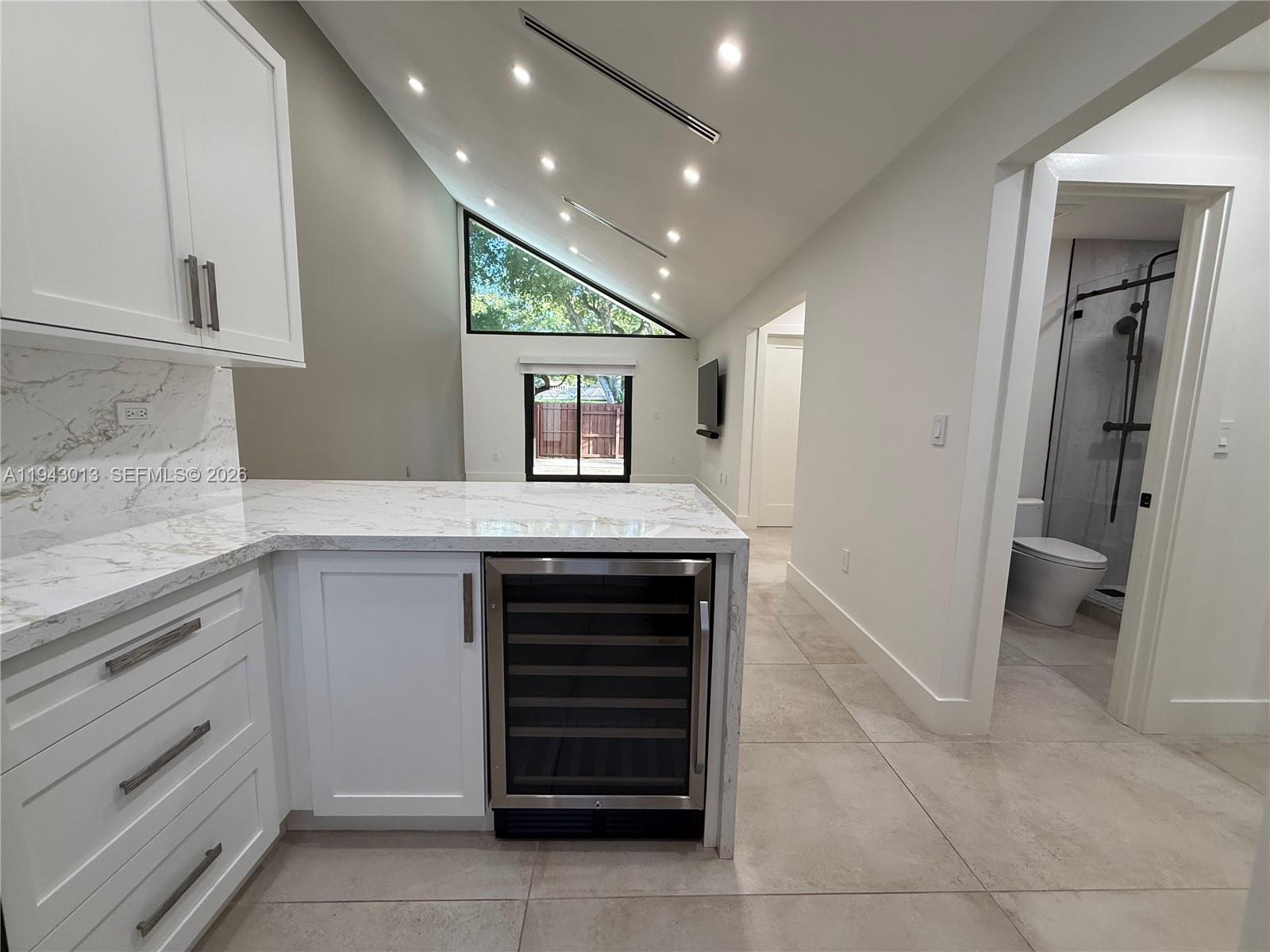9208 Southwest 132nd Street Miami, FL 33176 - Photo 6 of 24 a kitchen with a refrigerator and a sink