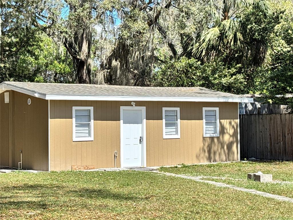 124 Coronado Road, Unit B DeBary, FL 32713 - Photo 18 of 18 a view of a backyard with a large tree