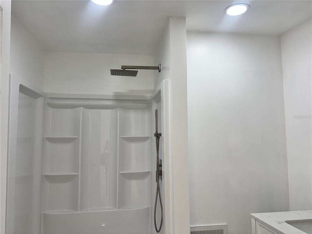 124 Coronado Road, Unit B DeBary, FL 32713 - Photo 10 of 18 a bathroom with a shower