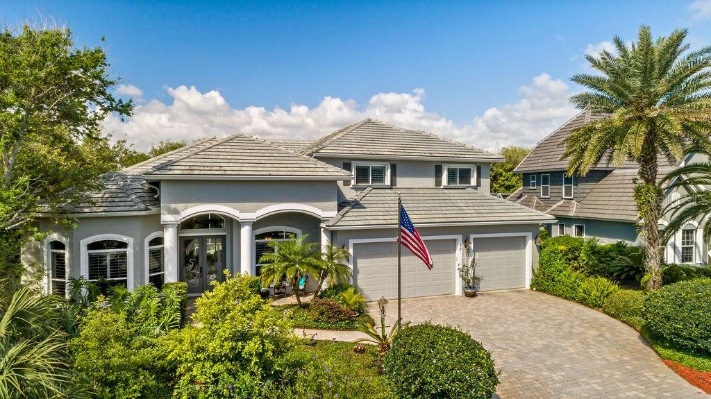 82 Inlet Point Boulevard Ponce Inlet, FL 32127 - Photo 1 of 1 a front view of a house with a yard