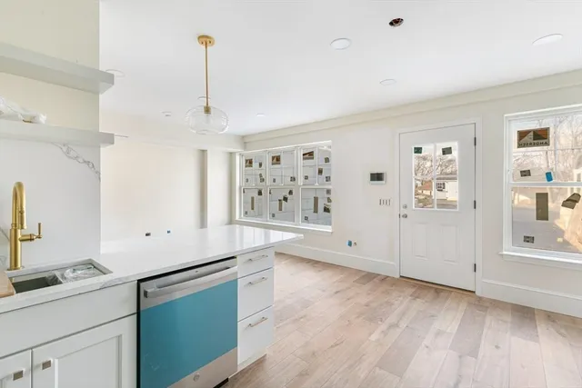 a view of a kitchen with electric appliances