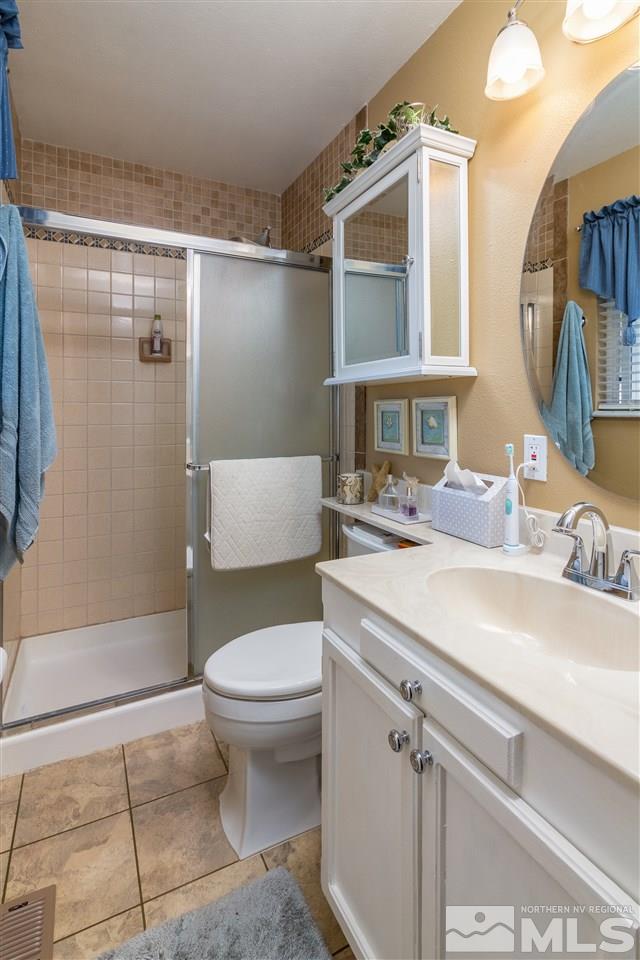 3375 Kings Row Reno, NV 89503 - Photo 8 of 15 a bathroom with a sink toilet and shower