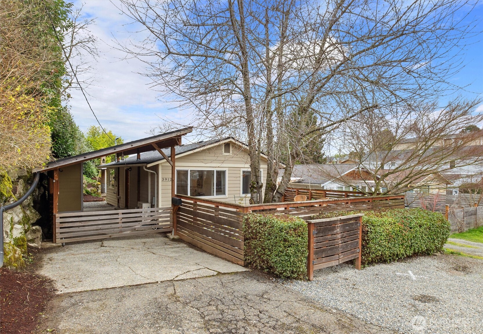 3912 South Findlay Street Seattle, WA 98118 - Photo 2 of 36 a front view of a house with parking space
