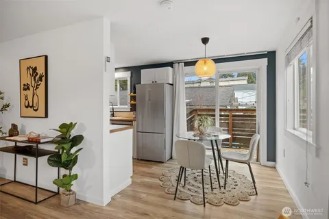 a kitchen with a table and chairs