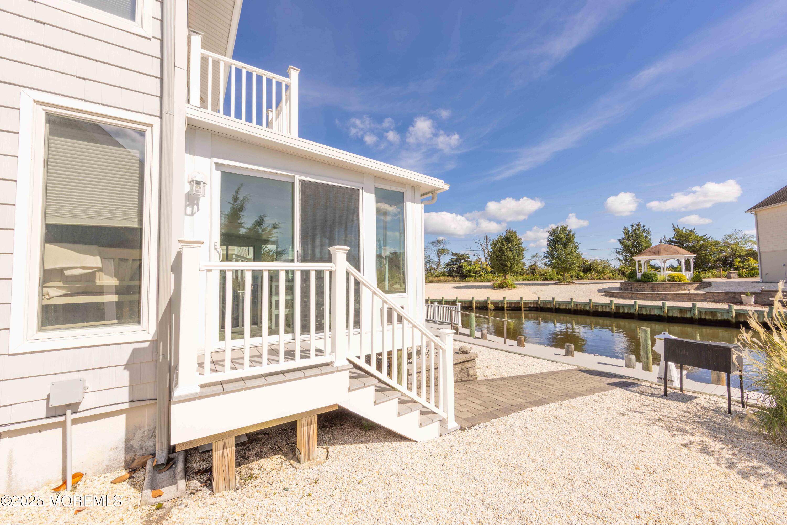 5 Hunter Drive Little Egg Harbor, NJ 08087 - Photo 12 of 76 a view of a balcony with lake view and floor to ceiling windows