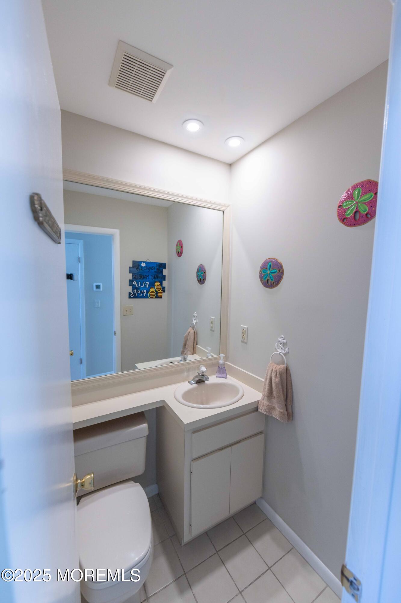 5 Hunter Drive Little Egg Harbor, NJ 08087 - Photo 20 of 76 a bathroom with a sink toilet and a mirror