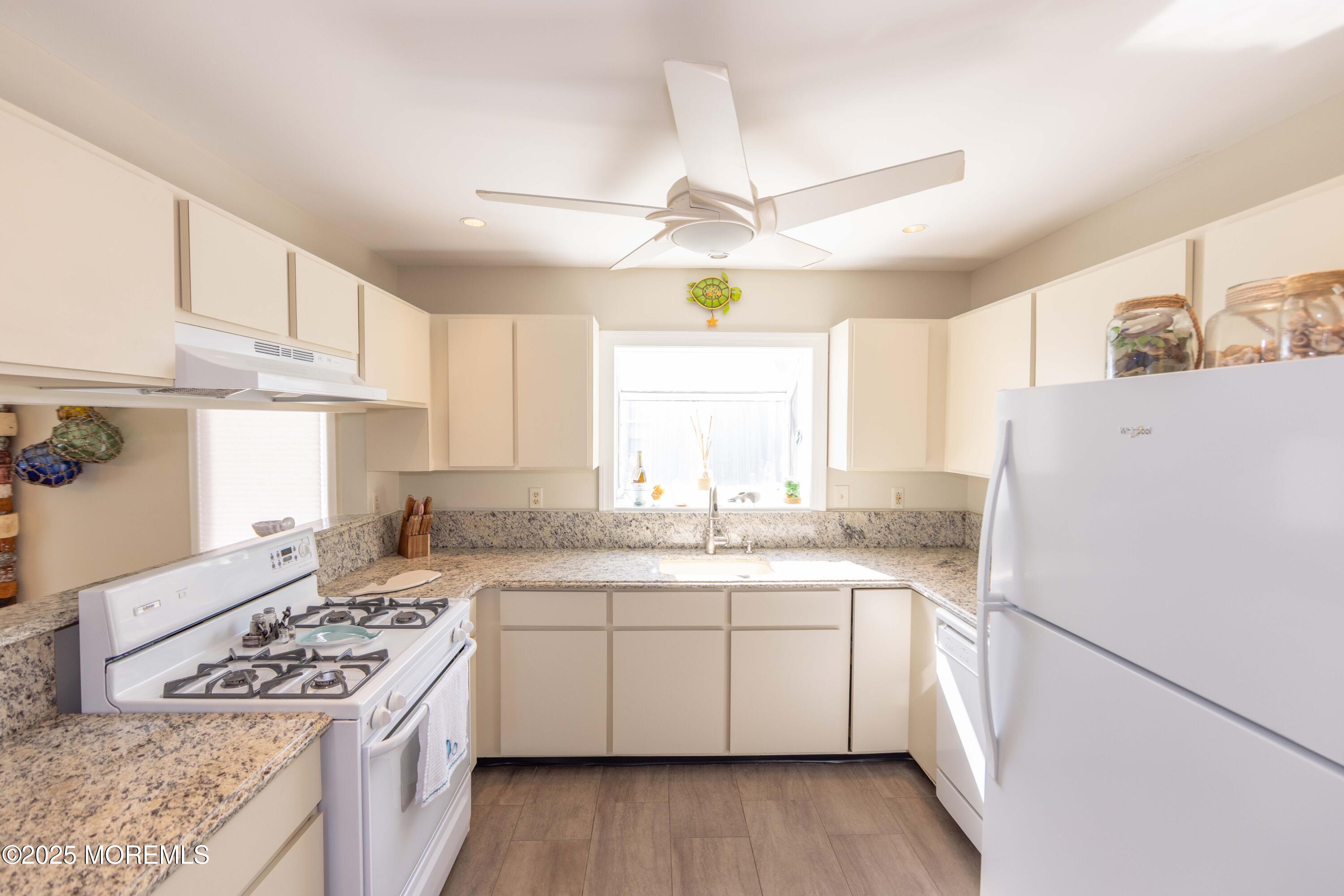 5 Hunter Drive Little Egg Harbor, NJ 08087 - Photo 21 of 76 a kitchen with a white cabinets stove and refrigerator