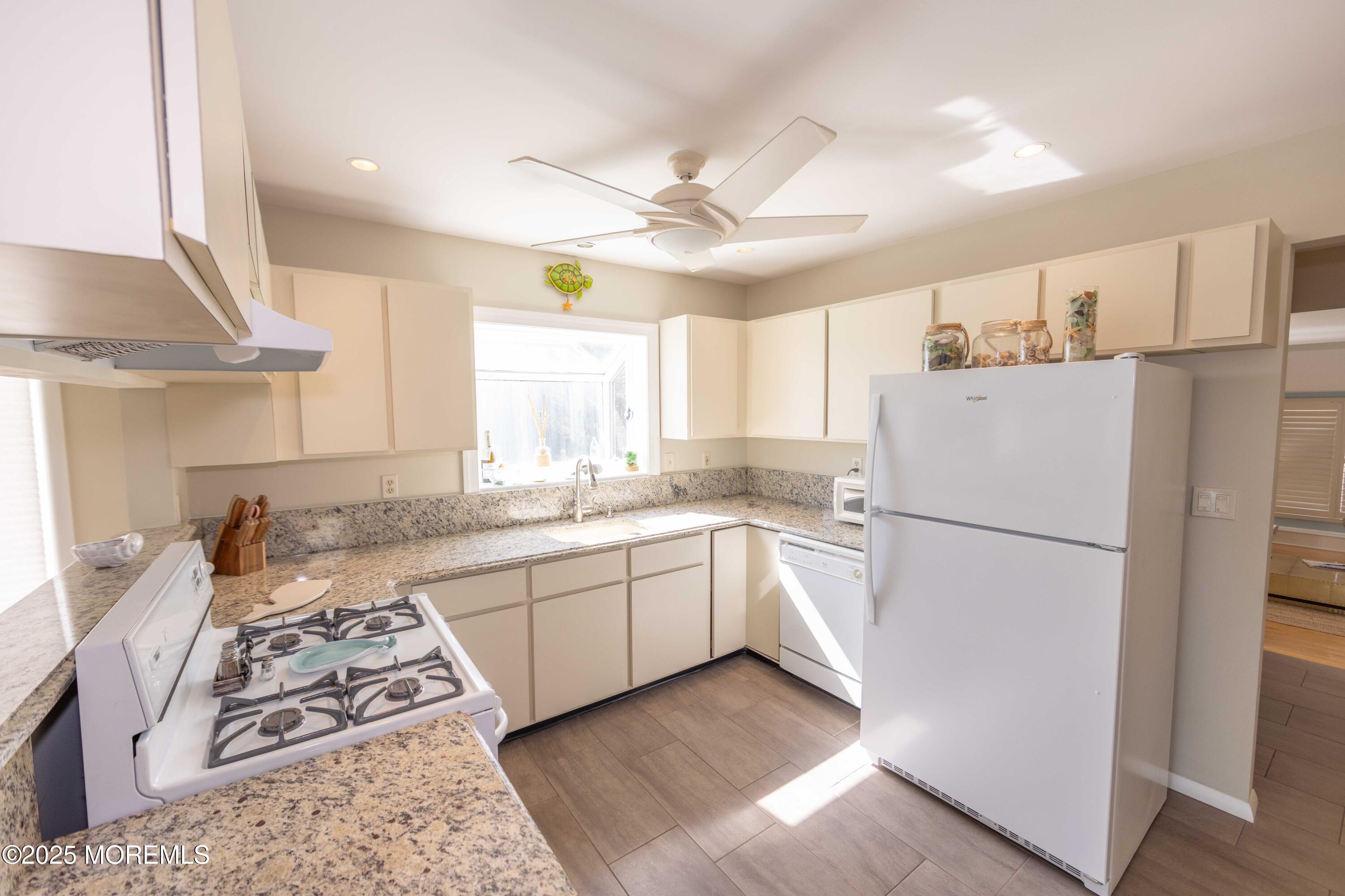 5 Hunter Drive Little Egg Harbor, NJ 08087 - Photo 22 of 76 a kitchen with stainless steel appliances granite countertop a refrigerator sink and stove