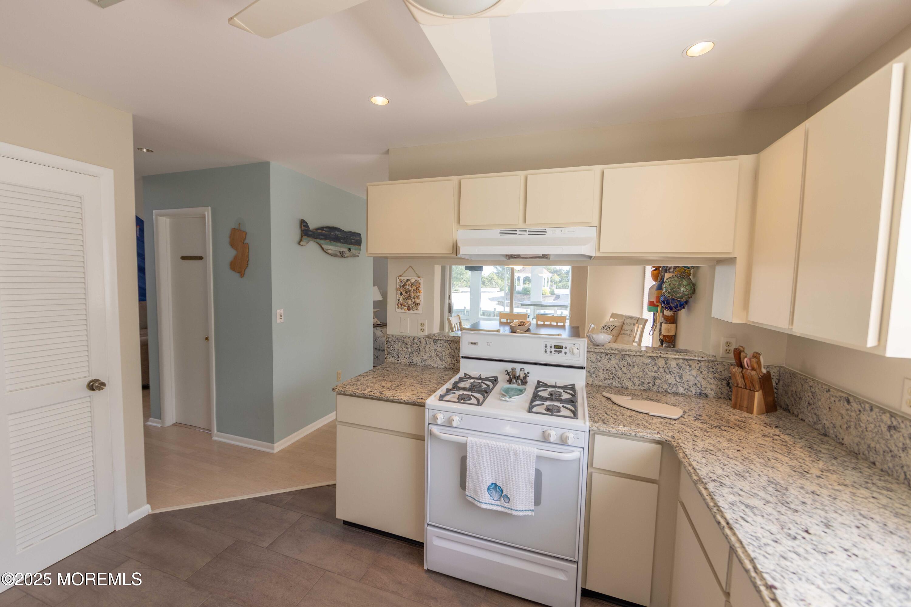 5 Hunter Drive Little Egg Harbor, NJ 08087 - Photo 25 of 76 a kitchen with a stove a sink and a refrigerator
