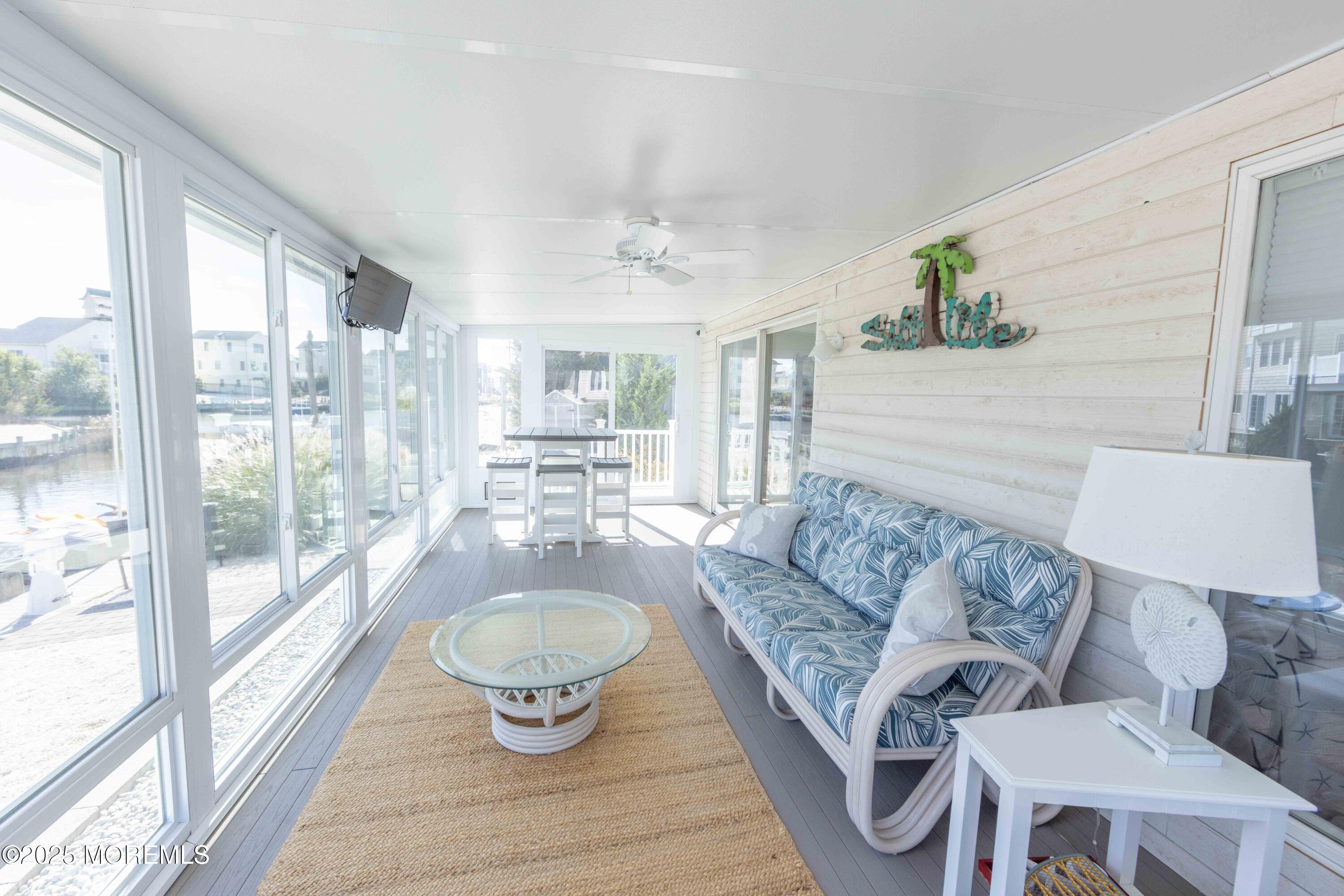 5 Hunter Drive Little Egg Harbor, NJ 08087 - Photo 36 of 76 a living room with furniture and a floor to ceiling window
