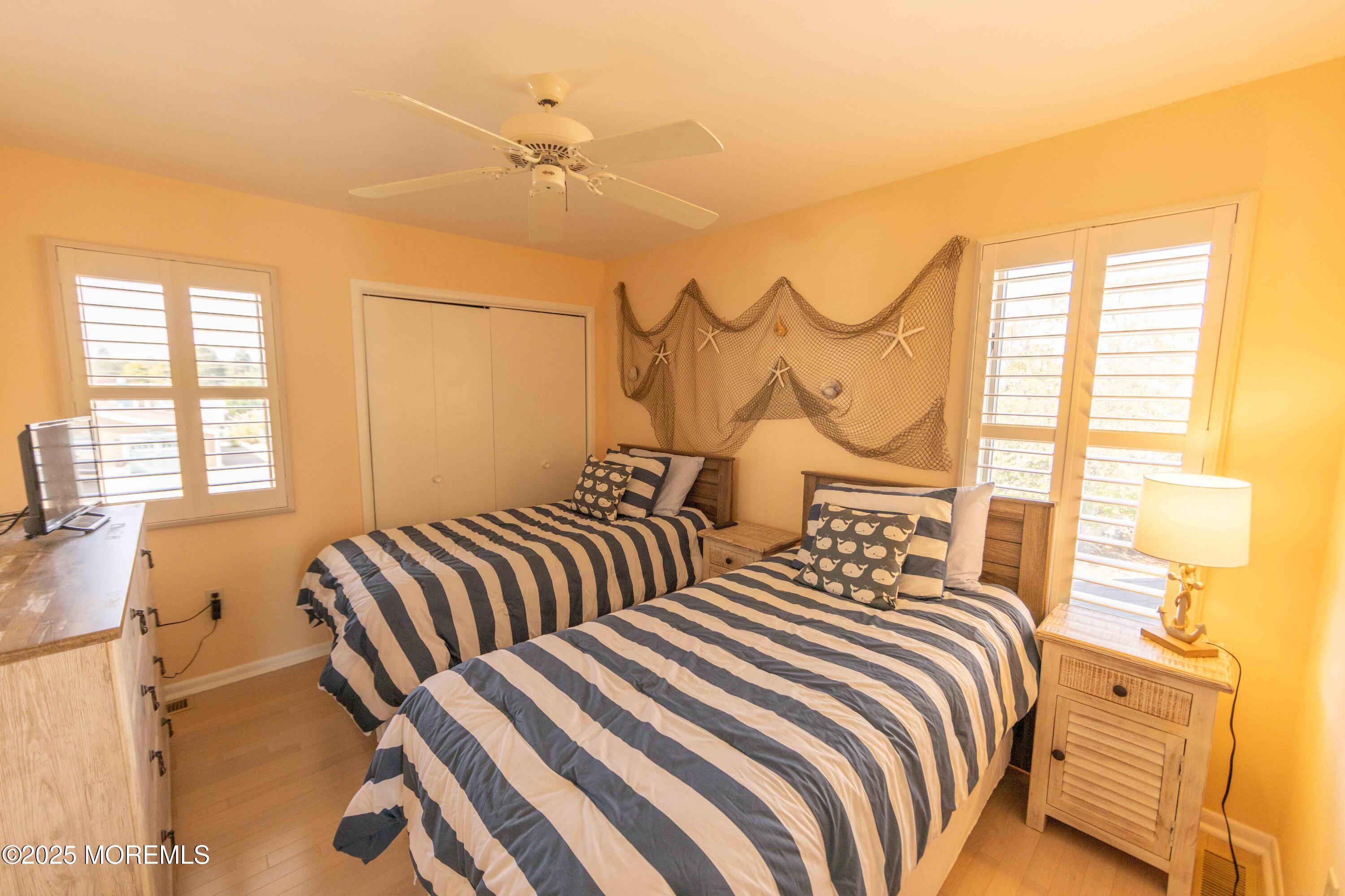 5 Hunter Drive Little Egg Harbor, NJ 08087 - Photo 41 of 76 a bedroom with two beds and a window