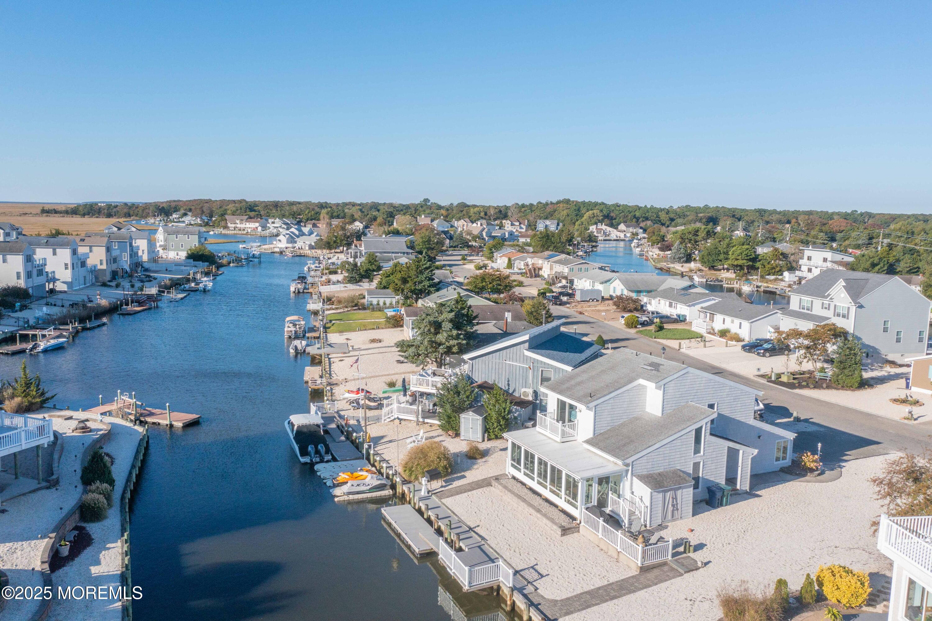 5 Hunter Drive Little Egg Harbor, NJ 08087 - Photo 57 of 76 an aerial view of a city with lots of residential buildings and ocean view in back