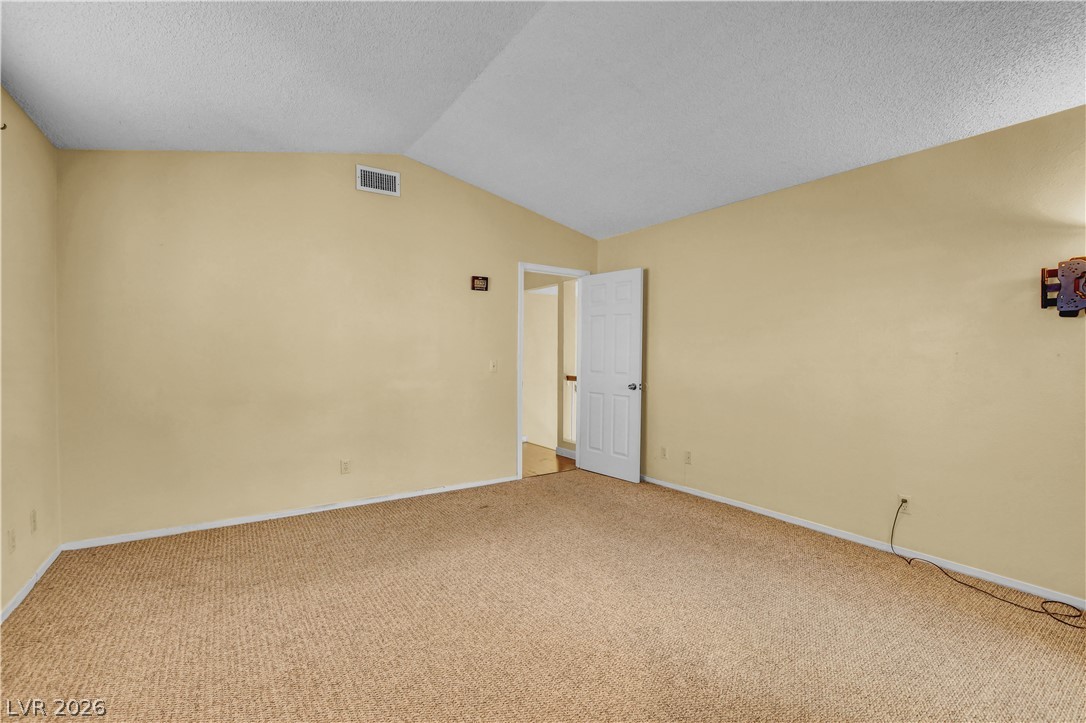 6440 Hartwood Road Las Vegas, NV 89108 - Photo 29 of 59 A versatile room awaits personalization, offering ample space for rest or creative endeavors.