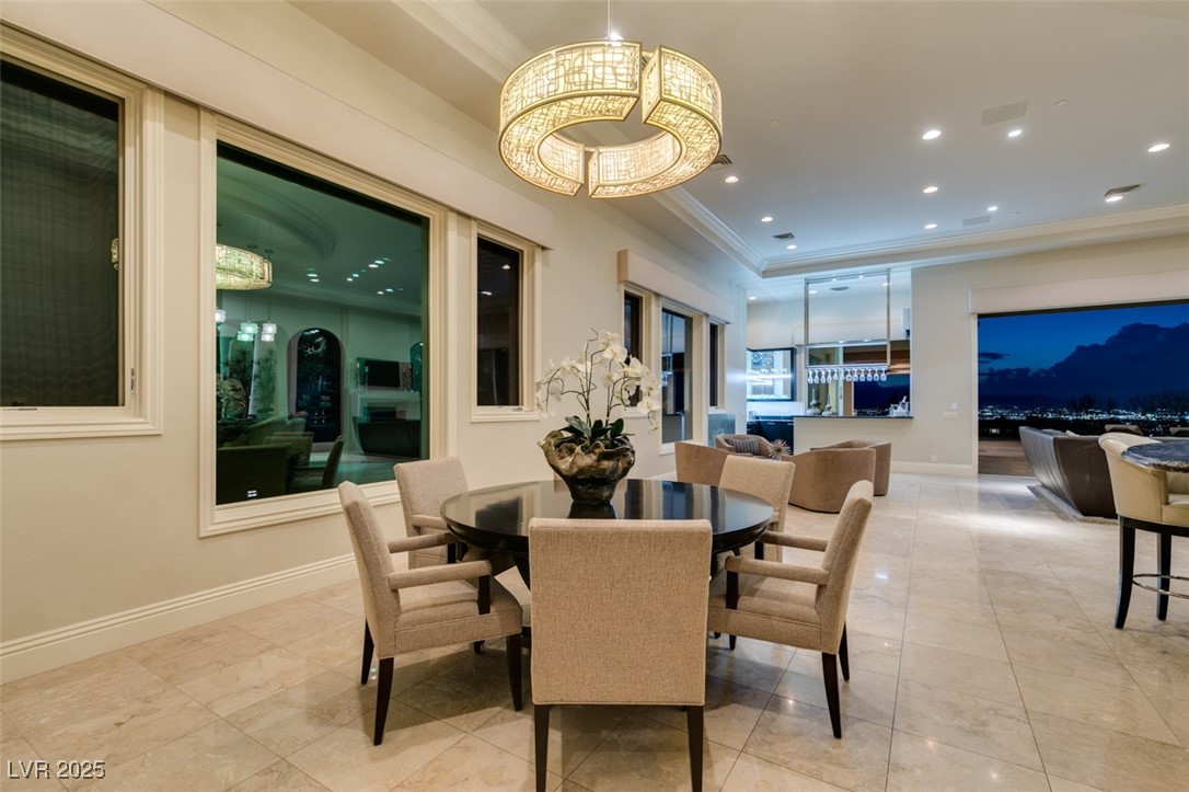 4 Awbrey Court Henderson, NV 89052 - Photo 22 of 72 Dining room with a tray ceiling, light tile patterned floors, recessed lighting, and ornamental molding