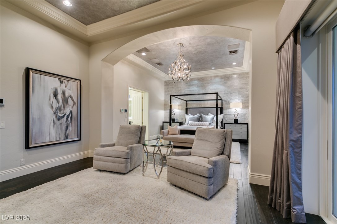 4 Awbrey Court Henderson, NV 89052 - Photo 34 of 72 Bedroom with arched walkways, a chandelier, dark wood-type flooring, ornamental molding, and recessed lighting