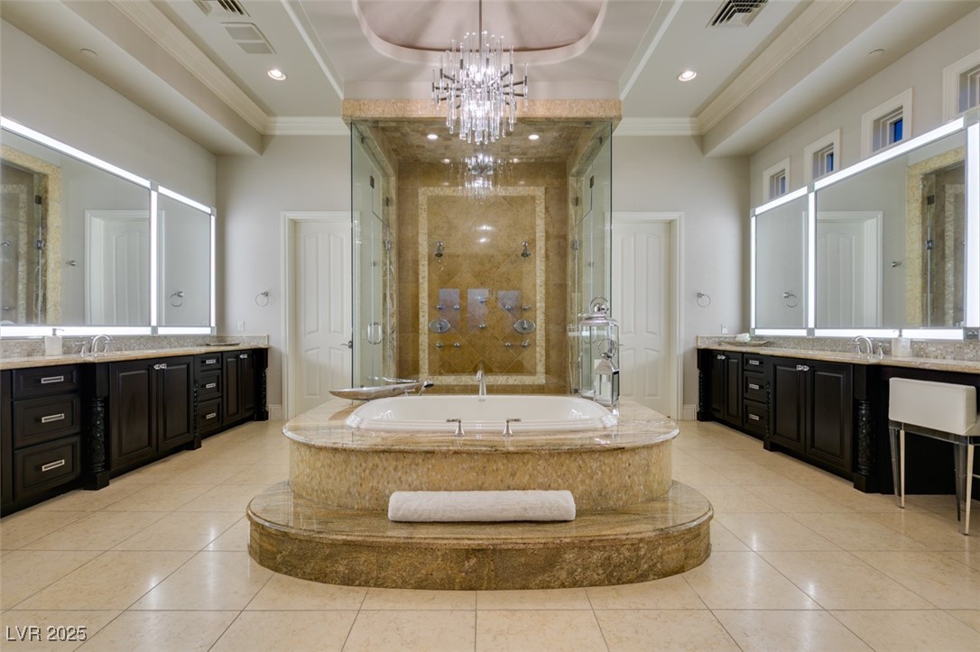 4 Awbrey Court Henderson, NV 89052 - Photo 35 of 72 Full bathroom featuring a shower stall, a bath, vanity, crown molding, and a tray ceiling