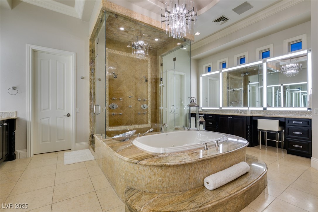 4 Awbrey Court Henderson, NV 89052 - Photo 36 of 72 Bathroom with a chandelier, vanity, a stall shower, crown molding, and a garden tub