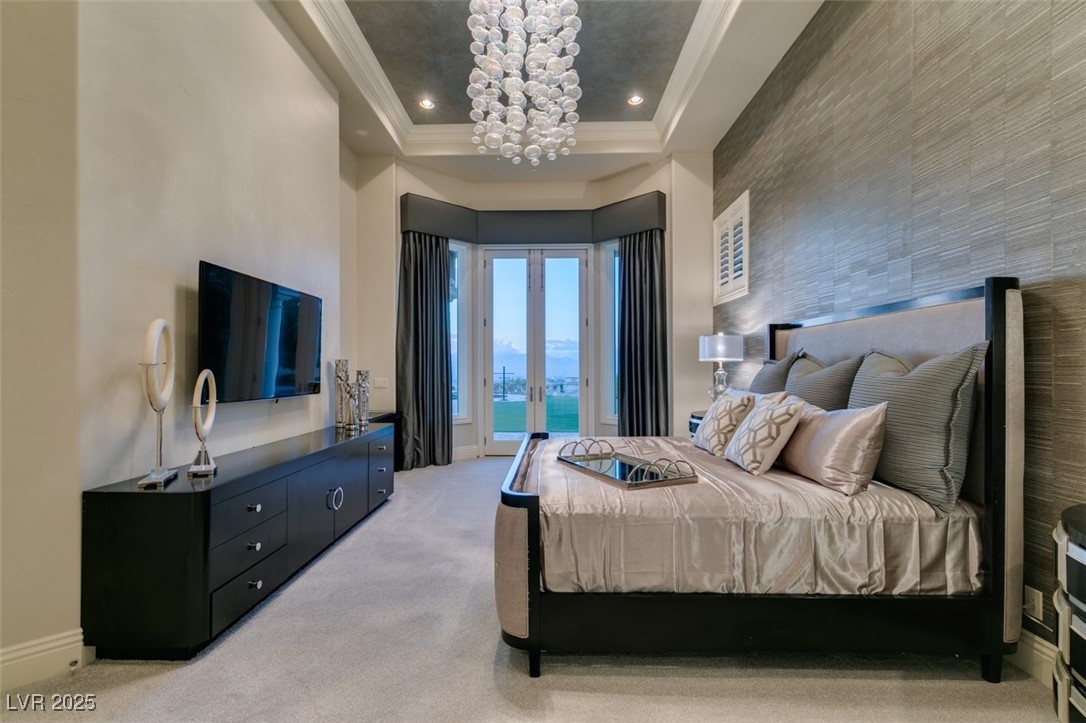4 Awbrey Court Henderson, NV 89052 - Photo 38 of 72 Bedroom featuring light carpet, french doors, access to outside, an accent wall, and crown molding