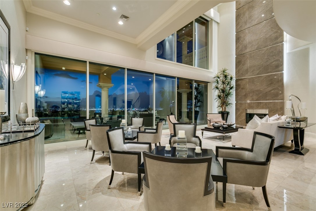 4 Awbrey Court Henderson, NV 89052 - Photo 4 of 72 Building lobby featuring ornamental molding, a towering ceiling, and recessed lighting