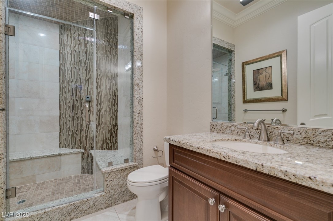 4 Awbrey Court Henderson, NV 89052 - Photo 49 of 72 Bathroom with a stall shower, vanity, crown molding, and light tile patterned floors